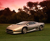 AUT 12 RK0141 05
1994 Jaguar XJ220 Silver Side 3/4 View On Grass Trees Background
