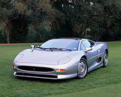 AUT 12 RK0142 01
1994 Jaguar XJ220 Silver Front 3/4 View On Grass Trees Background