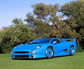 AUT 12 RK0147 03
1994 Jaguar XJ220 Blue 3/4 Low Front View On Grass Trees Blue Sky