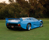AUT 12 RK0150 01
1994 Jaguar XJ220 Blue 3/4 Rear View On Grass Trees Background