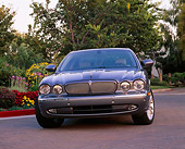 AUT 12 RK0172 03
2004 Jaguar XJR Gray 3/4 Front View By Flowers Trees