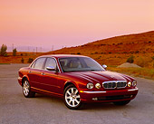 AUT 12 RK0187 01
2004 Jaguar XJ Burgundy 3/4 Front View On Pavement By Grass Hill Filtered