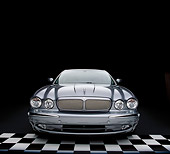 AUT 12 RK0191 13
2004 Jaguar XJR Gray Wide Angle Head On View Checkered Floor Studio