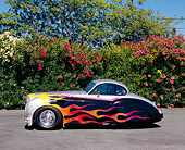 AUT 12 RK0204 01
1952 Jaguar MK VII Silver With Flames Side View On Pavement By Pink Flower Bush