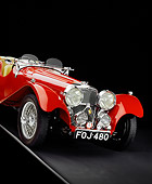 AUT 12 RK0211 05
1939 Jaguar SS100 Convertible Red Slanted 3/4 Front View Studio