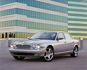 AUT 12 RK0215 02
2006 Jaguar, XJ R, Silver Front 3/4 View On Pavement By Building