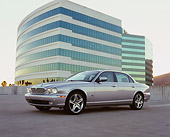 AUT 12 RK0216 01
2006 Jaguar, XJ R, Silver Side 3/4 View On Pavement By Building