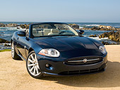 AUT 12 RK0224 01
2007 Jaguar XK Convertible Blue 3/4 Front View On Sand