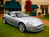 AUT 12 RK0251 01
2007 Jaguar XKR Silver 3/4 Front View On Grass By Building