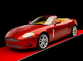 AUT 12 RK0267 02
2007 Jaguar XKR Convertible Red 3/4 Front View Red Floor Studio