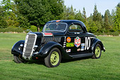 AUT 13 RK0431 01
1935 Ford Nascar Coupe #10 Black 3/4 Front View On Grass By Trees