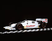 AUT 13 RK0022 02
1988 Lola Cosworth Indy Racing Car 3/4 Side View On Checkerboard Studio