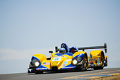 AUT 13 RK0066 01
Mazda Courage P2 Yellow Race Car 3/4 Front View On Track