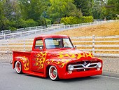 AUT 14 BK0038 01
1954 Ford F-100 Pickup Truck Hot Rod Red With Flames 3/4 Front View On Pavement By Fence And Trees
