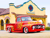 AUT 14 BK0043 01
1954 Ford F-100 Pickup Truck Hot Rod Red With Flames 3/4 Front View On Pavement By Building