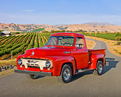 AUT 14 BK0044 01
1954 Ford F-100 Pickup Truck Red 3/4 Front View On Pavement By Crops