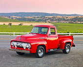 AUT 14 BK0046 01
1954 Ford F-100 Pickup Truck Red 3/4 Front View On Pavement By Crops