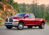 AUT 14 BK0049 01
2010 Dodge Ram 3500 Pickup Truck Red 3/4 Front View On Pavement By Trees
