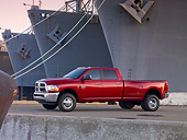AUT 14 BK0050 01
2010 Dodge Ram 3500 Pickup Truck Red 3/4 Side View On Dock By Ships