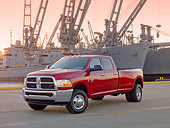 AUT 14 BK0055 01
2010 Dodge Ram 3500 Pickup Truck Red 3/4 Front View On Dock By Ships At Dusk