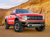 AUT 14 BK0062 01
2011 Ford F-150 SVT Raptor Pickup Truck Red 3/4 Front View On Sand By Cliffs