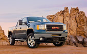 AUT 14 BK0064 01
2011 GMC Sierra Pickup Truck Blue 3/4 Front View On Gravel By Red Rocks