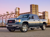 AUT 14 BK0066 01
2011 GMC Sierra Pickup Truck Blue 3/4 Front View On Gravel By Structure