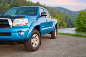 AUT 14 BK0073 01
2011 Toyota Tacoma Double Cab Pickup Truck Blue 3/4 Front View On Gravel By River In Forest