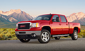 AUT 14 BK0083 01
2012 GMC Sierra Pickup Truck Red 3/4 Front View On Pavement By Mountains