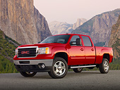 AUT 14 BK0084 01
2012 GMC Sierra Pickup Truck Red 3/4 Front View On Pavement By Mountains