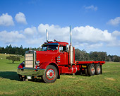 AUT 14 RK0079 01
1965 Peterbilt Model 351 Red Truck 3/4 Side View On Grass By Trees Blue Sky