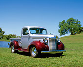 AUT 14 RK0085 01
1940 Chevrolet 1/2 Ton Truck Silver And Maroon 3/4 Front View On Grass By Water