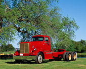 AUT 14 RK0088 03
1950 Diamond T Model Semi Truck Red 3/4 Side View On Grass By Trees