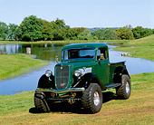 AUT 14 RK0089 03
1935 Ford 4 Wheel Drive Truck Green And Black 3/4 Front View On Grass By Water