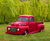 AUT 14 RK0092 09
1950 Ford Pickup Truck Raspberry Red 3/4 Front View On Grass By Trees