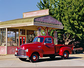 AUT 14 RK0102 03
1952 Chevrolet Pickup Truck Red 3/4 Side View In Front Of Old Gas Station
