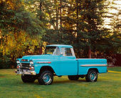 AUT 14 RK0121 02
1959 Chevrolet Apache Pickup Truck Aqua 3/4 Side View On Grass By Trees