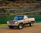 AUT 14 RK0145 03
1986 Chevrolet Silverado 1/2 Ton 4x4 Truck 3/4 Side View On Dirt By Water