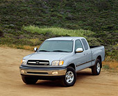 AUT 14 RK0147 03
2000 Toyota Tundra 4x4 SR5 V8 Platinum Metallic 3/4 Front View On Dirt By Bushes Hill Headlights On