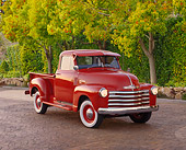 AUT 14 RK0376 11
1952 Chevrolet Pick Up Truck Red With Fulton Visor 3/4 Front View On Brick By Trees