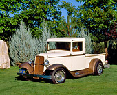 AUT 14 RK0436 03
1933 Ford Pickup Truck Cream And Light Brown 3/4 Front View On Grass
