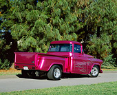 AUT 14 RK0455 01
1955 Chevy Modified Truck Violet 3/4 Rear View On Pavement By Trees