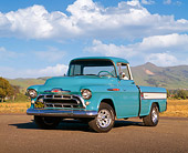 AUT 14 RK0494 03
1957 Chevy Cameo Pick Up Truck Blue 3/4 Front View On Pavement By Hills