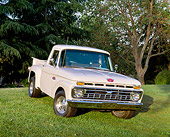 AUT 14 RK0506 06
1965 Ford F-100 Pick Up Truck White 3/4 Front View On Grass By Trees