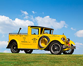 AUT 14 RK0517 05
1922 Lincoln AAA Tow Truck Yellow 3/4 Side View On Grass Against Blue Sky