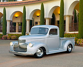AUT 14 RK0637 01
1946 Chevy 1/2 Ton Silver Front 3/4 View On Pavement By Building And Trees