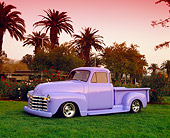 AUT 14 RK0655 02
1950 Chevy Pickup Truck Periwinkle 3/4 Side View On Grass By Trees Filtered