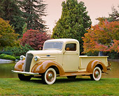 AUT 14 RK0677 01
1937 Chevrolet 1/2 Ton Pickup Truck Beige And Brown Side 3/4 Side View On Grass By Water And Autumn Trees