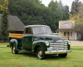 AUT 14 RK0682 02
1950 Chevrolet 3100 Deluxe Pickup Truck Black 3/4 Front View On Grass By General Store
