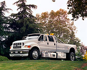 AUT 14 RK0691 07
2000 Ford F650 White 3/4 Side View On Grass Hill By Trees